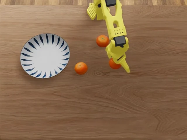Yellow robot gripper above oranges and a plate in the LeIsaac environment